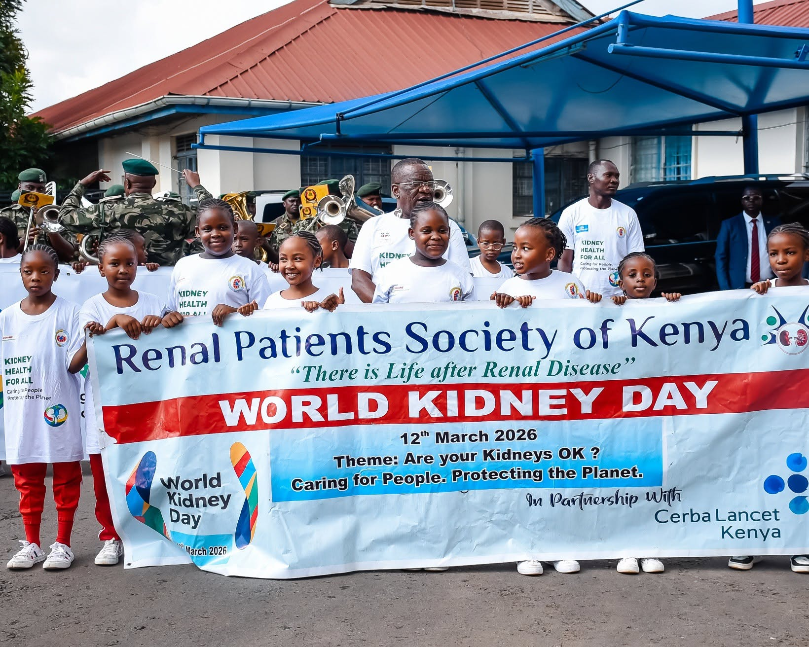 John Gikonyo beside the kidney guidelines workshop banner